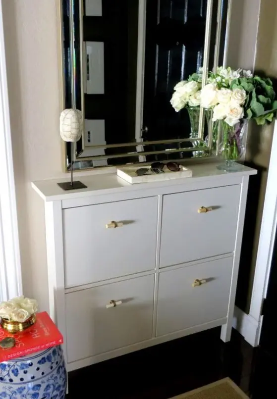 A white Hemnes shoe storage piece with new handles gets a fresh look and a new feel