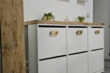a white IKEA Bissa hack with a stained countertop and gold handles is a lovely solution for a boho or modern space