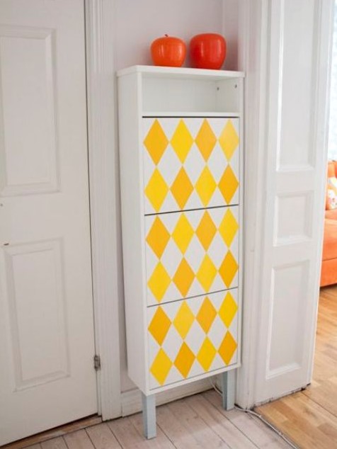 an IKEA Bissa hack done with legs, an open compartment and bright yellow geometric decals