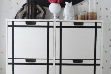 an IKEA Stall cabinet hacked with black stickers to form a pattern is a chic and bold modern idea to try