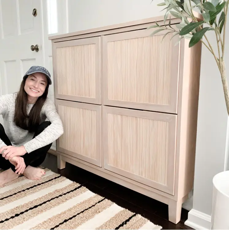 an IKEA Stall hack with fluted doors and frames is a cool solution for a modern entryway