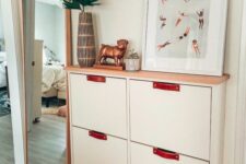 an IKEA Stall hack with leather pulls and a wooden countertop is a cool and stylish idea for a modern or boho space