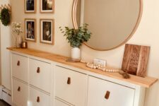 an IKEA shoe cabinet upgrade with a stained countertop and leather pills is a lovely idea for a boho space