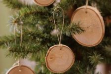 branch slice Christmas ornaments with twine are great for neutral farmhouse or woodland Christmas decor