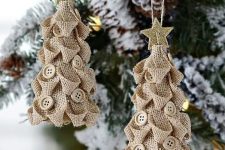 burlap Christmas tree ornaments with neutral buttons and glitter stars on top
