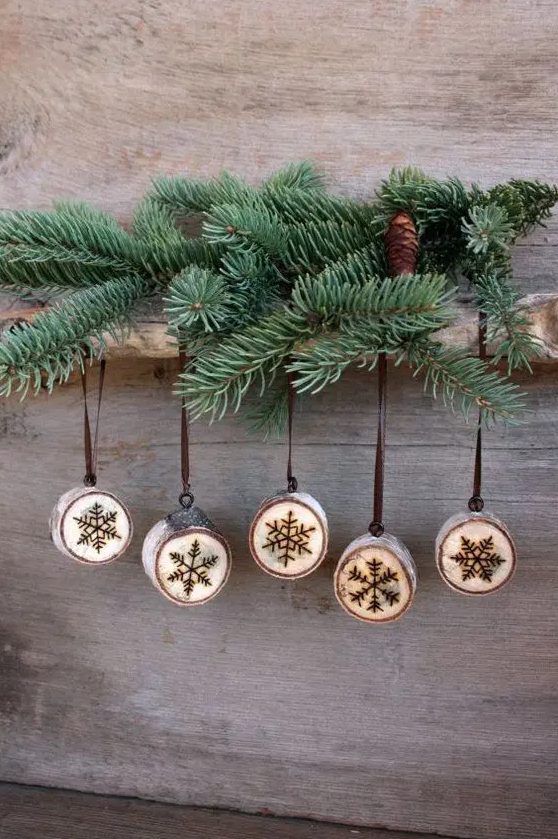 cute wood burnt snowlflake ornaments look rustic and very cute can be used as ornaments and favors