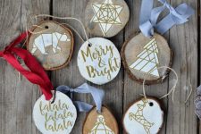 geometric wood slice ornaments with various decor, geometric animals and calligraphy are cool for tree decor