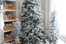 multiple flocked Christmas trees with no decor and no lights are amazing for cozy farmhouse decor