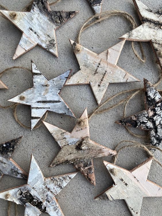 Simple and all natural birch bark star shaped Christmas ornaments are perfect for woodland or rustic holiday decor