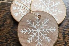 wood slice gilded edge snowflake ornaments look rustic and glam at the same time