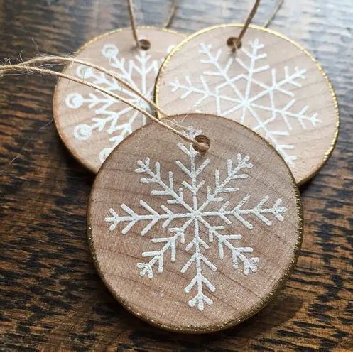 wood slice gilded edge snowflake ornaments look rustic and glam at the same time