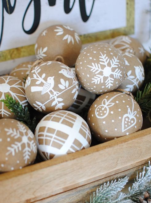 wooden Christmas ornaments with painted snowflakes, birds and plaid are perfect for rustic holiday decor