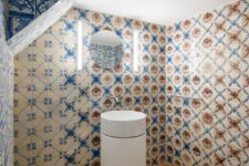 03 The powder room can boast of cool blue and white azulejo tiles for a bright and chic look