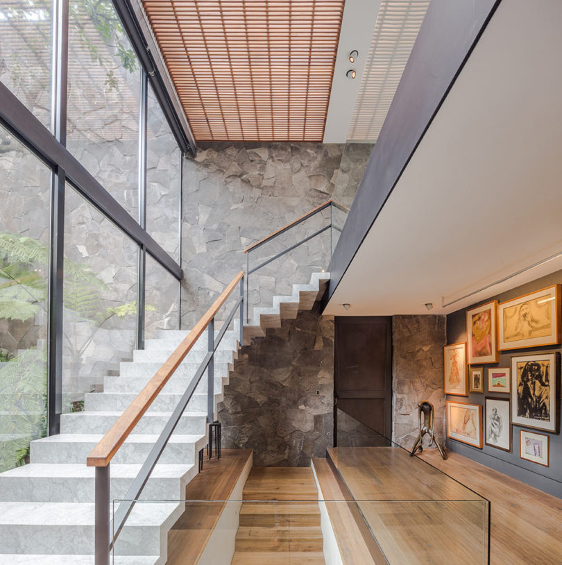 Stylish staircases connect the levels and large windows fill them with light and let enjoy the views
