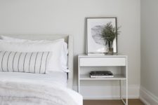05 The bedroom is all-neutral, with some prints and simple and stylish furniture