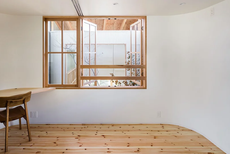 The second floor features a minimalist home office and some private zones - bedrooms