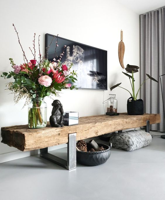 a light grey sleek floor and furniture on legs to make the space look larger and more light-filled