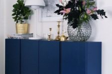 08 IKEA Ivar cabinets painted navy and with brass legs look super stylish and bold