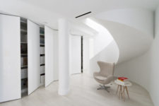 08 There’s a sculptural staircase that leads to an open space with much hidden storage