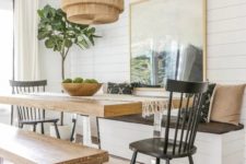 10 a cozy dining space with a table on a metal base and matching benches that repeat the table design