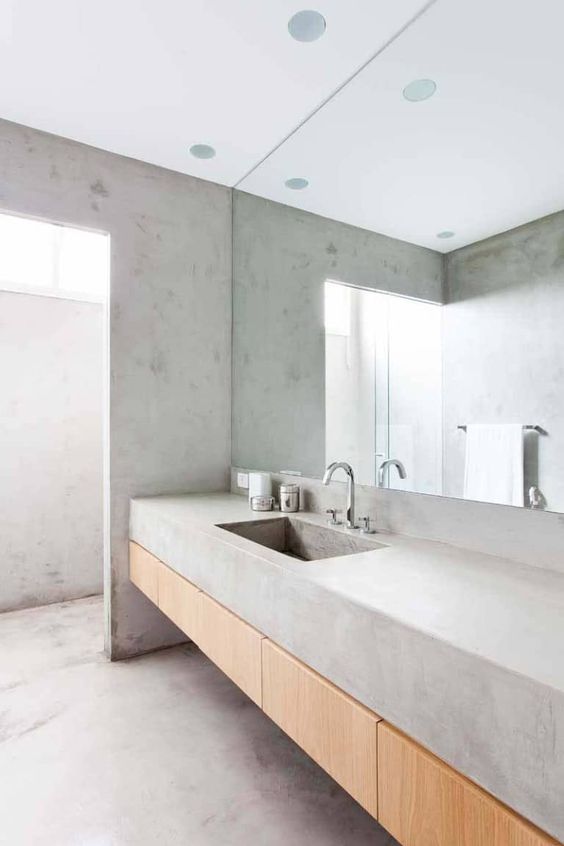 a concrete bathroom with all surfaces concrete is a trendy and simple idea for a modern space