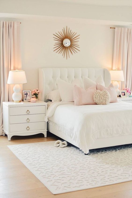 a white upholstered bed with a tufted headboard is nice for a cozy and at the same time luxurious bedroom