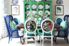 14 colorful printed chairs with emerald seats and bright navy wingback chairs to pair with them
