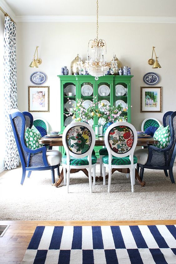 colorful printed chairs with emerald seats and bright navy wingback chairs to pair with them