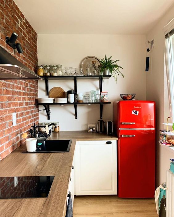 a bright red fridge brings color to the space and makes it fun, bright and welcoming