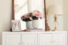 16 an IKEA Malm dresser turned into a chic vintage piece with overlays and brass knobs