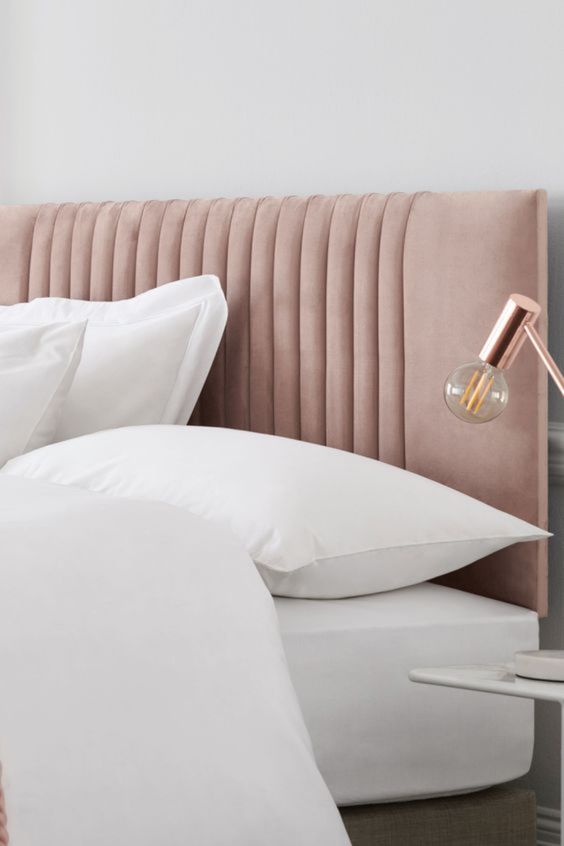 a chic blush upholstered headboard is a subtle and stylish touch of color to your bedroom