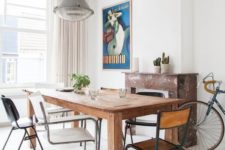 18 a chic dining space with a wooden table and mismatching chairs that make it evne more inviting and whimsy