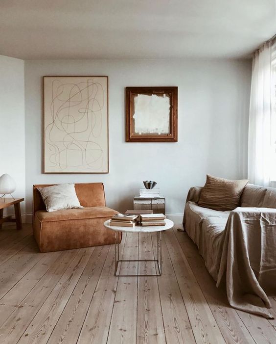 An airy and welcoming earthy tone interior in ocher, rust, neutrals and light colored wood