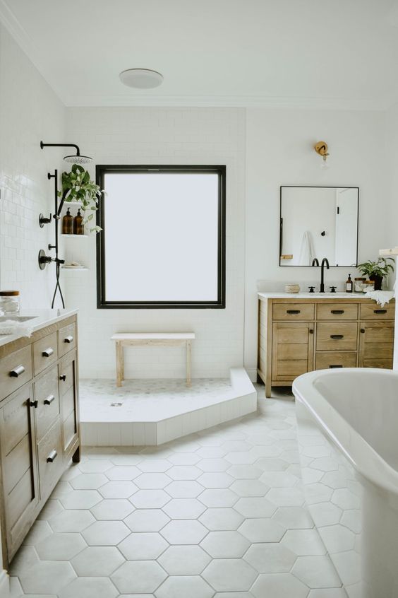 a neutral bathroom with a hexagon tile floor for a chic and cool touch of geoetry to the space
