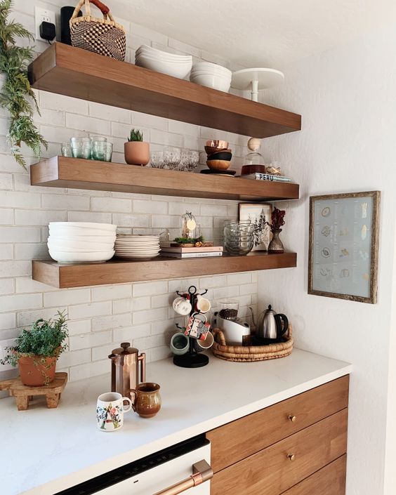 thick open shelves match the kitchen cabinets and look statement-like