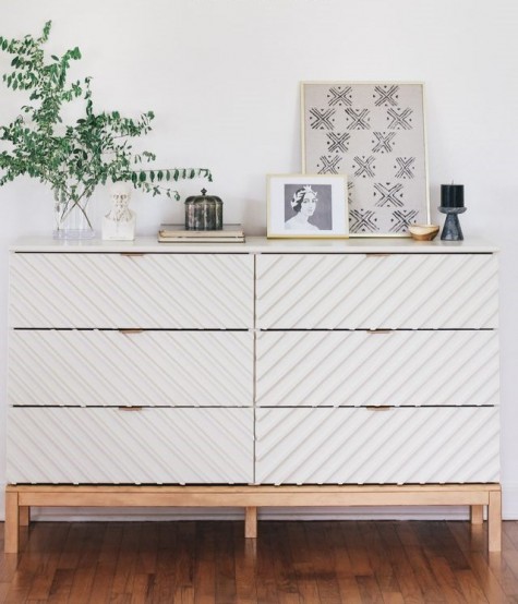an IKEA Tarva dresser is made amazing with wooden dowels and some white paint