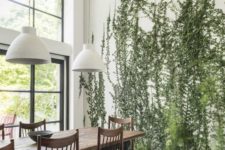 23 tall green plants growing right in the floor make the space cool, fresh and very natural