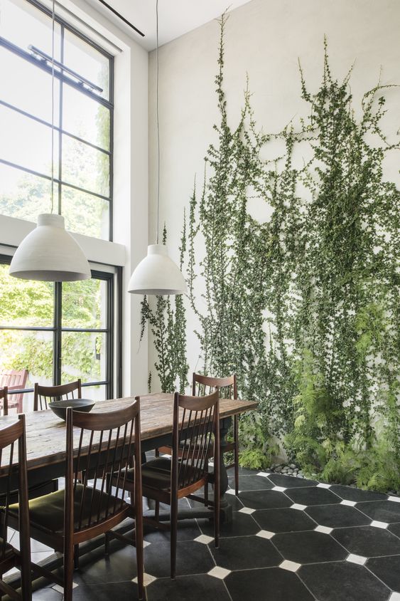 tall green plants growing right in the floor make the space cool, fresh and very natural