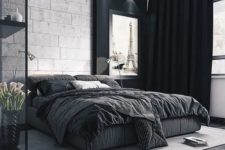 24 a bold black and white bedroom with dark floors, black curtains and a glass storage unit