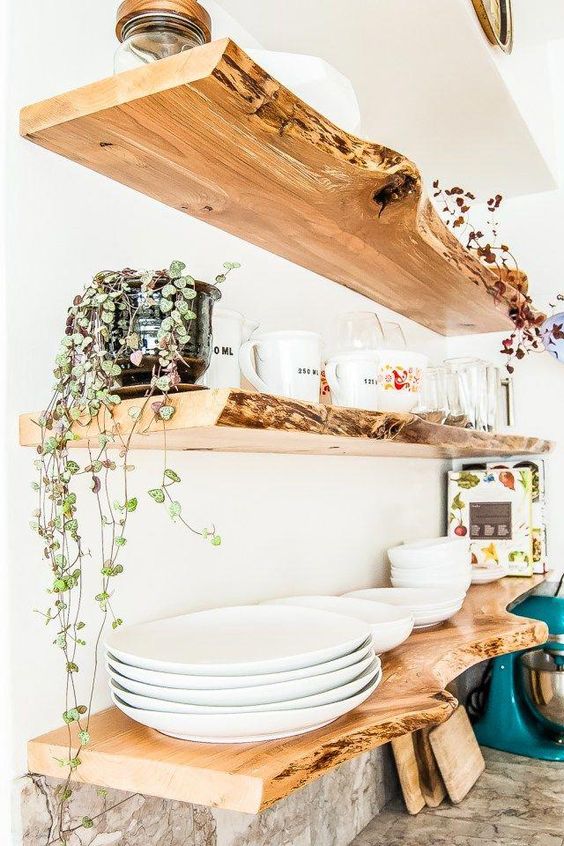 think of live edge open shelving to brign a natural feel to the kitchen, it's a trendy idea