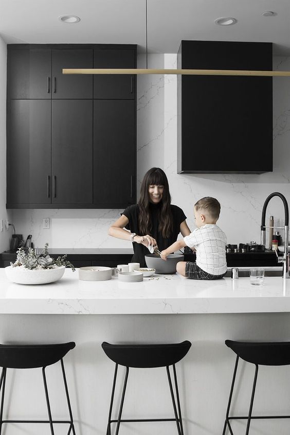 a stylish and bold black and white kitchen with white marble is a very elegant contemporary idea