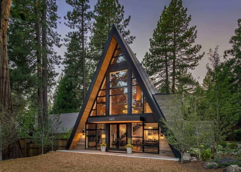 This a frame cabin inspires living in the wild, its roof extends to the ground and it's unique