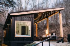 01 This contemporary cabin is built of a shipping container and indoor and outdoor areas are placed under the same roof