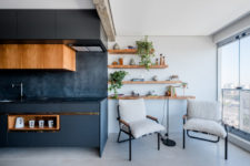 black kitchen design with wooden touches