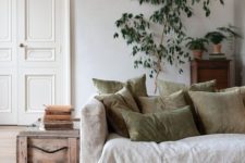 02 a neutral living room in various soft shades with plenty of texture and potted greenery and a tree