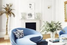 a cute living room with a blue sofa