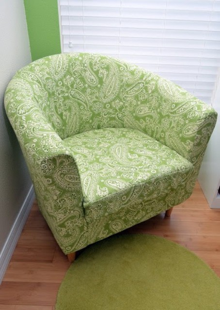 a reupholstered with bright botanical print fabric IKEA Tullsta chair is a bold idea and you can fit any fabric you like