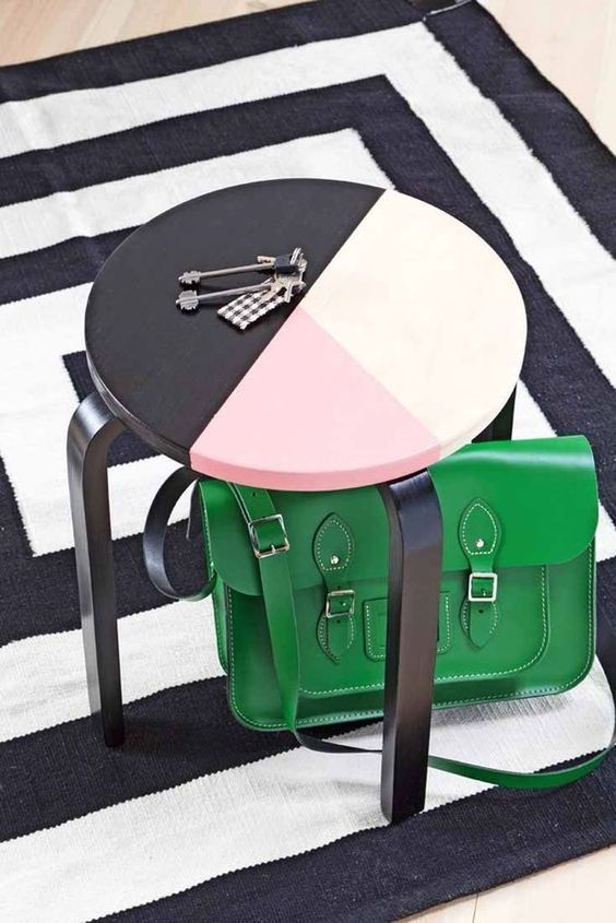 an IKEA Frosta stool painted with color blocking can double as a side table