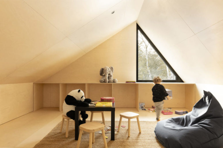 The upper, attic space, is given to the kid, it's a comfortable and cozy playspace with cool furniture