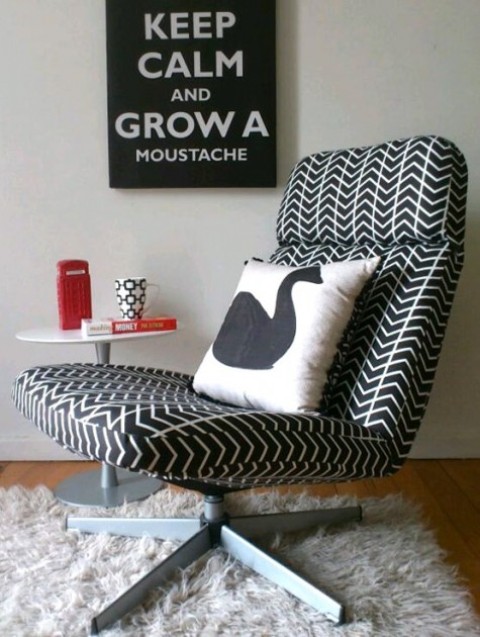 a comfortable IKEA Lunna chair reupholstered with graphic print black and white fabric and with a printed pillow